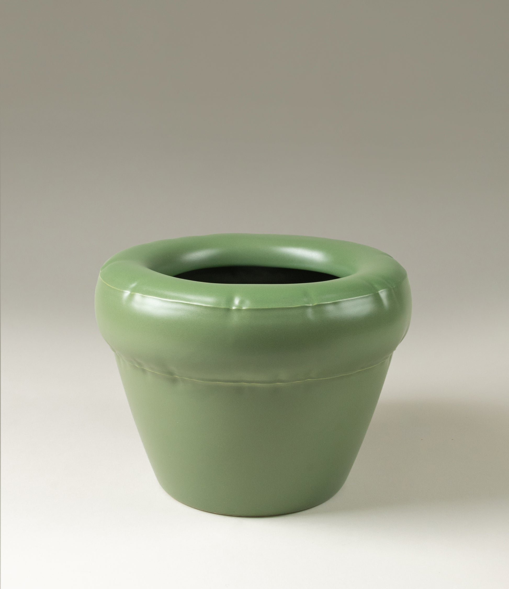 Homestudyo planter pierre in moss color. The planter design looks like and inflatable ballon although it is made of ceramics